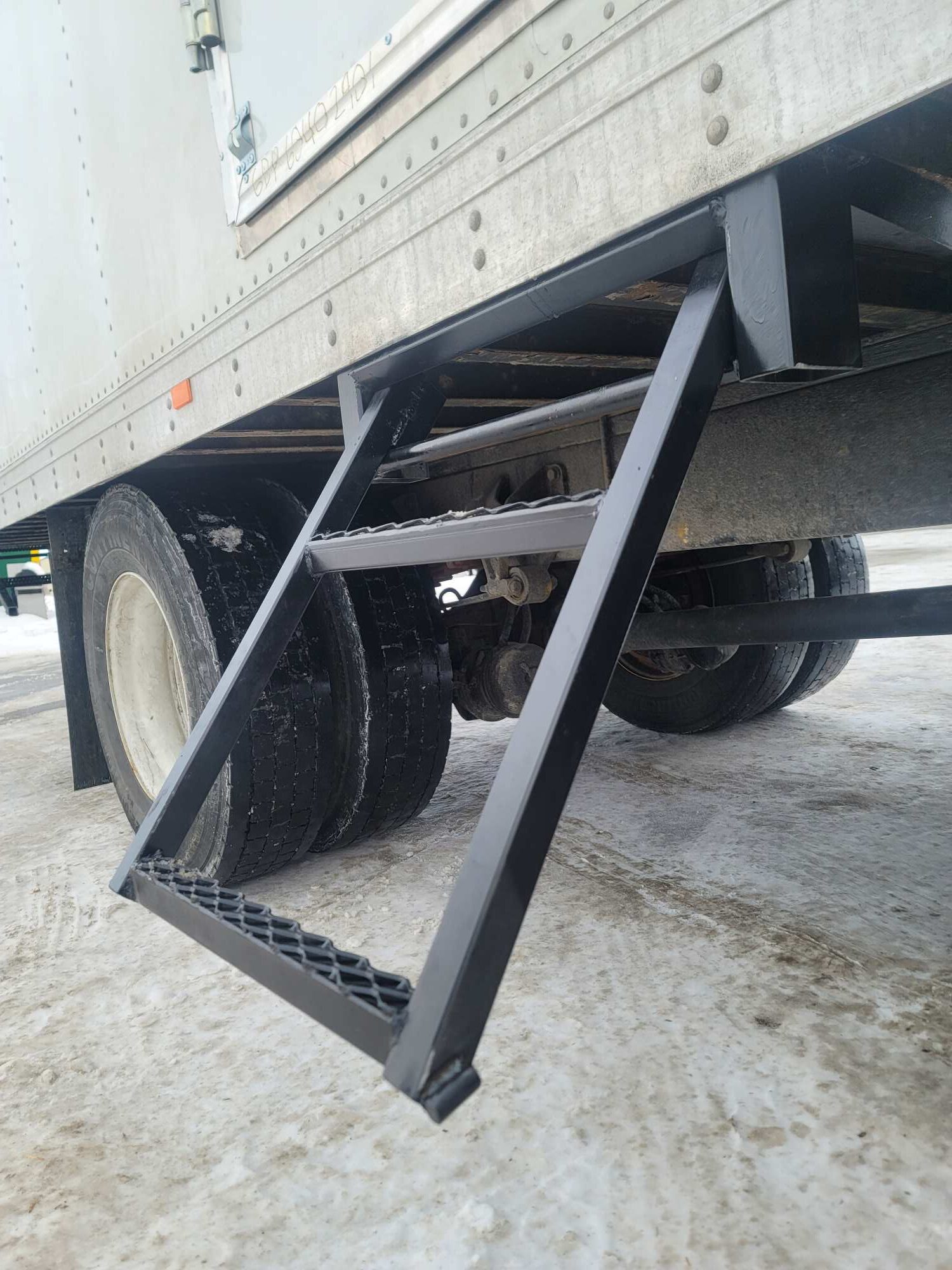 Image of brand new retractable stairs on the side of a semi going to the side door in Williston, ND